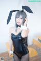 A woman in a bunny costume posing for a picture.