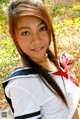 A woman in a sailor outfit posing for a picture.