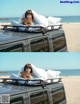 A woman laying on top of a car with a teddy bear.