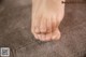 a close up of a person's foot with a pair of socks on