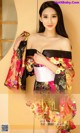 A woman in a kimono posing for a magazine cover.